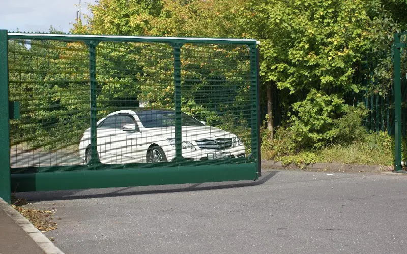 Car Entering Cantilever Gates Installed and Maintenaned by BGB Car Entering Cantilever Gates Installed and Maintenaned by BGB